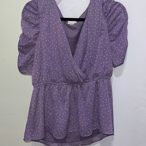 Purple and white polkadot shirt